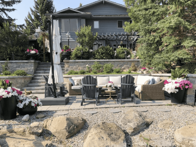 New Look Landscapes Calgary - Backyard Makeover with Paver Patio Retaining Wall Gardens and Stairs
