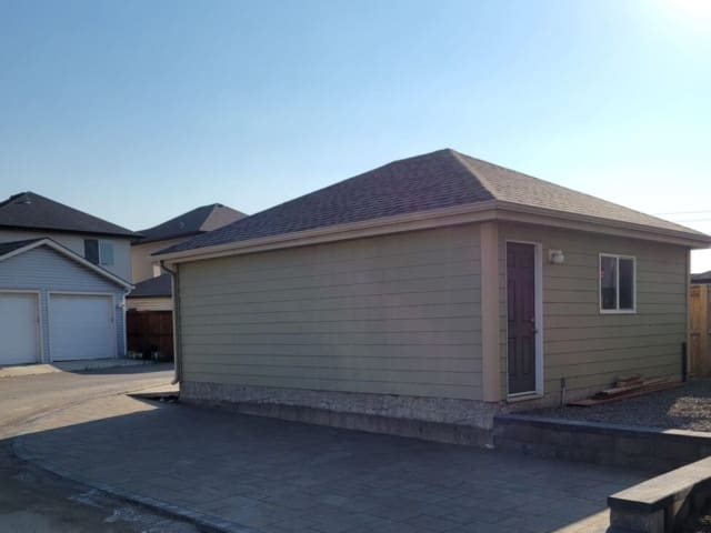 New Look Landscapes Calgary Projects: Progress Photo - Backyard Patio Pad Corner Lot with Retaining Wall